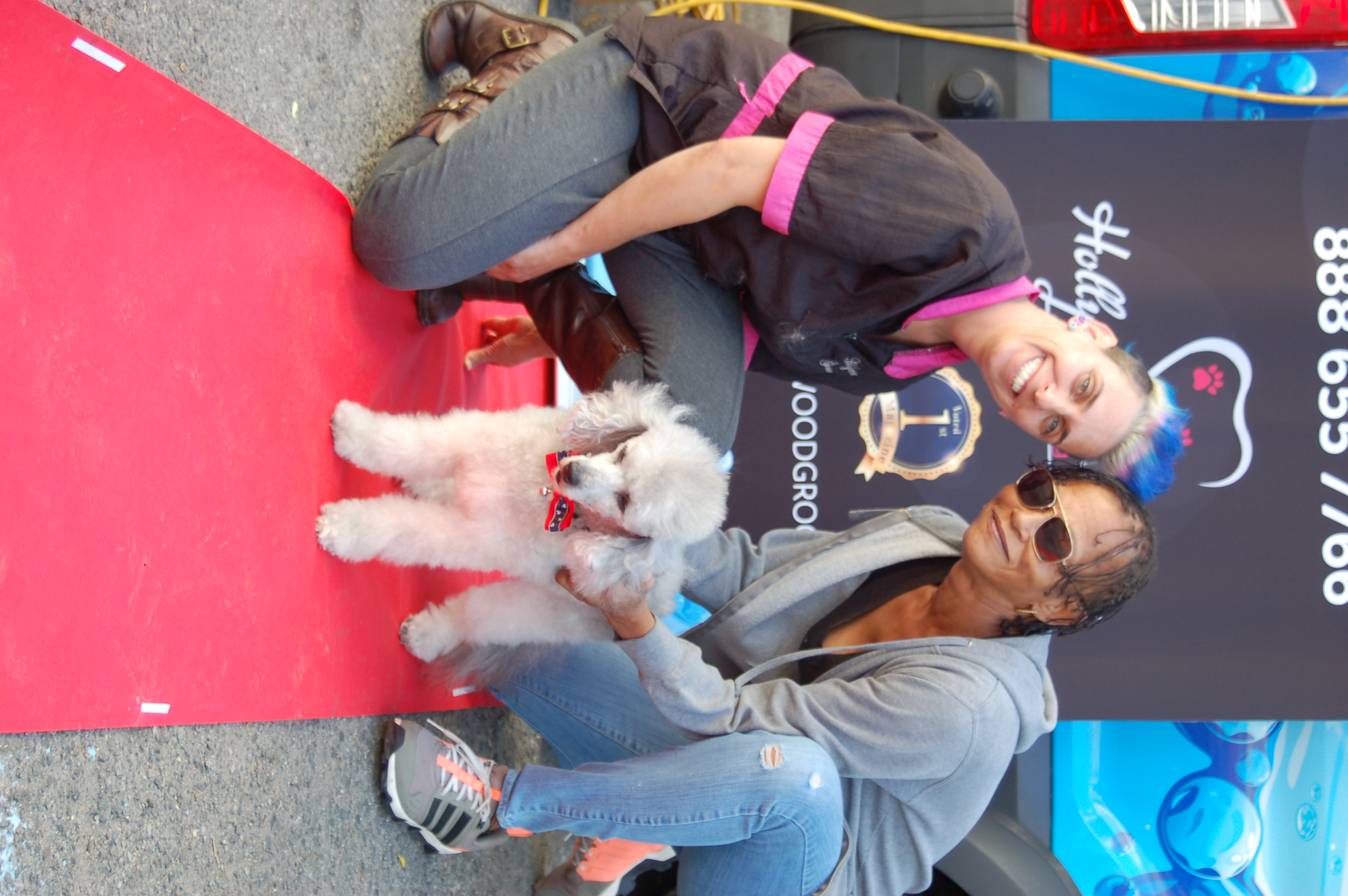 Yael and a pet owner on the red carpet at a Community Event.