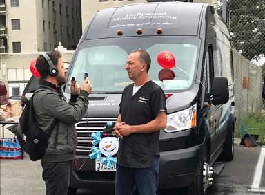 Chuck is interviewed at a Skid Row Community event.
