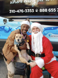 Santa and friends at a Hollywood Mobile Grooming Christmas event.